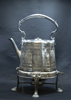 Silver hot water kettle with burner, left side