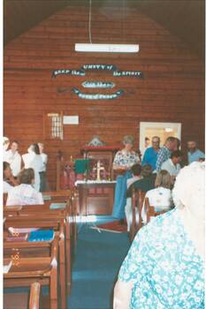 A colour photograph showing interior of Scotsburn Union Church and audience at an Organ Festival Performance 1997