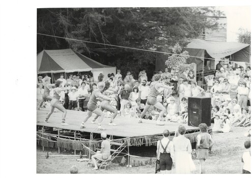 Black and White image of an athletic performance on stage in De Soza Park for the Buninyong Festival 1984