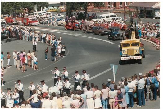 Colour photograph showing part of Festival procession 1985 featuring a brass band and various historical and contemporary motor vehicles