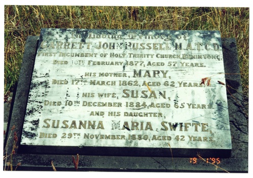 Headstone of Garrett John Russell and members of his family, marble, inlaid brass letters, some missing.