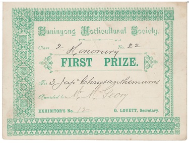 Award certificate, ornate, detailed borders, green printing on cream card.