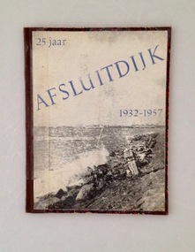 Book, 25 Jaar Afsluitdijk 1932-1957 (25 years of the Enclosure Dike), 1957.  A stamp - 5 mei 1958 - indicates the library acquired it the following year