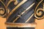 A raised inscription on the vertical stand that reads "1 2 3"