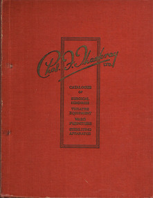 Red hard cover book with gilded lettering for its name.
