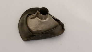 While the rubber lining around the outside of the facemask has hardened and become misshapen, the metal interior remains robust.