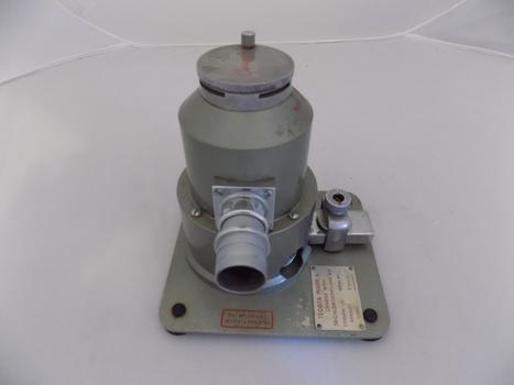 The small Tecota vaporiser is much heavier than it looks, with a metal plate at the base, and a round body all in green metal.