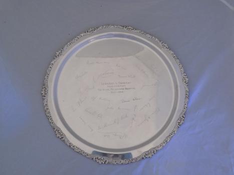 On his retirement from the Royal Melbourne Hospital, Dr Lennard Travers was presented with a round silver tray where colleague's signatures were also etched into the tray.
