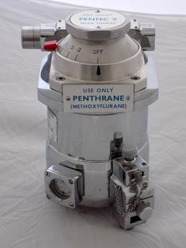 The cylindrical body has a step up to the dial plate with a small red latch to lock dial in to place. On the front of the body sits a square gauge to indicate the level FULL along with a long rectangular shape.