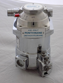 The cylindrical body has a step up to the dial plate with a small red latch to lock dial in to place. On the front of the body sits a square gauge to indicate the level FULL along with a long rectangular shape.