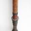 The mouthpiece for the blowpipe has been carved out of one section and attached to the tube. The engravings represent plants used to develop the poison used in hunting.
