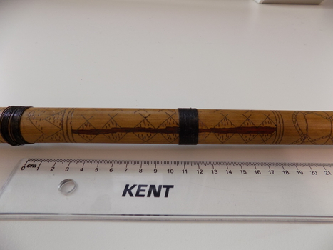 The engravings along the blowpipe are used for a variety of cultural purposes including helping to identify the correct plants to use when making the poison used in hunting.