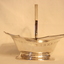 Silver plated copper basket with swing handle, with a geometric and circular pattern around the brim and a phoenix engraved into the handle.