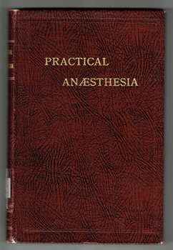 A deep red/maroon cover with black mottled effect, sits behind the gilded title of the book, Practical Anaesthesia.