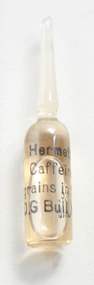 An ampoule of caffeine, with coffee coloured liquid inside.