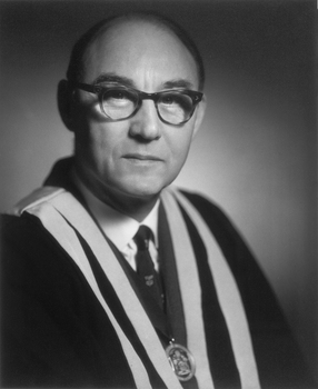 The moody tones used by Athol Shmith creating a compelling black and white portrait of Dr Robert Orton.