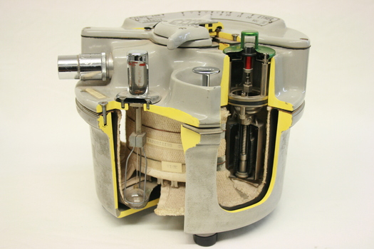 An E.M.O. ether vaporiser, showing the sectioned interior from the side of the object. 