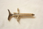 A metal dental syringe, sectioned lengthwise through the barrel.