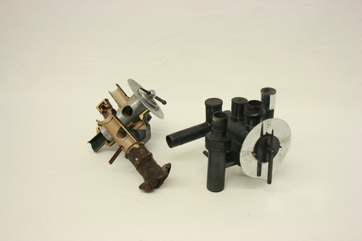 Two Renton circle valve absorbers. The one on the left has been sectioned.