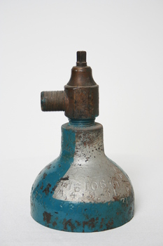 The top part of a gas cylinder with brass valve attached