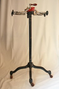 A sectioned Clarke apparatus on a stand with castors.
