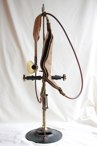 A Weller Ash nitrous oxide apparatus on an ornamental iron stand