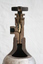 The sectioned outflow regulator valve of a gas cylinder