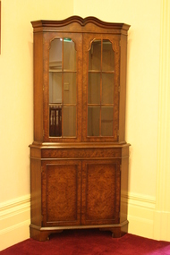 A Victorian-style corner cabinet