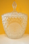A large crystal bowl with a lid.