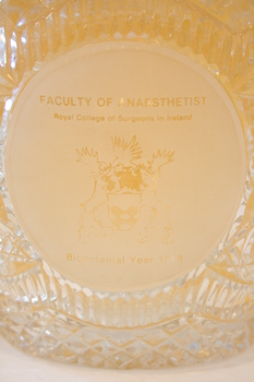The etching on the front of the crystal bowl.