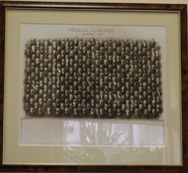A black-and-white photographic collage mounted on a beige mounting board and tortoise-shell finish backing board.