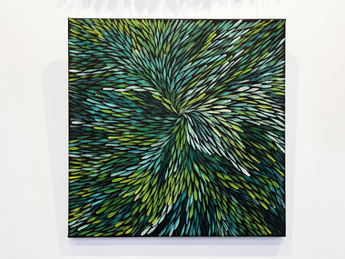 An abstract painting with green and white leaf-like patterns.