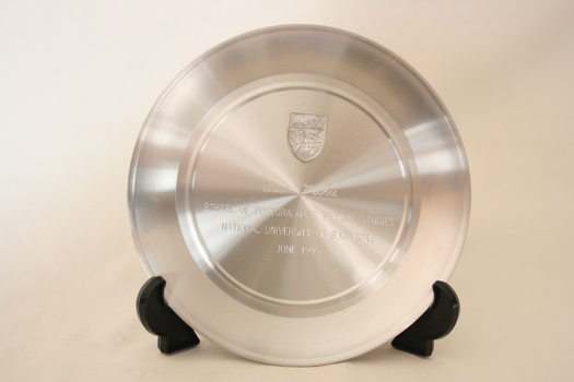 The front of the round pewter tray with an inscription.