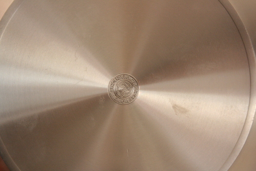 The back of the round pewter tray, with Phoenix Pewter logo.