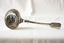 A sterling silver soup ladle.