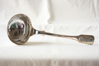 A sterling silver soup ladle.