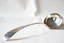 A silver soup ladle.