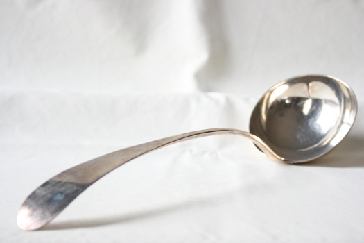 A silver soup ladle.