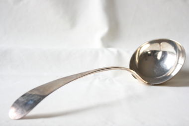 A silver soup ladle.