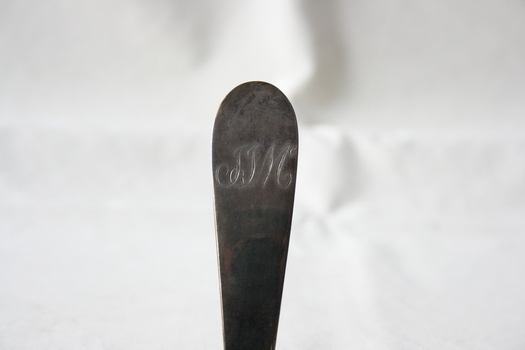 The inscription on the reverse of the handle.