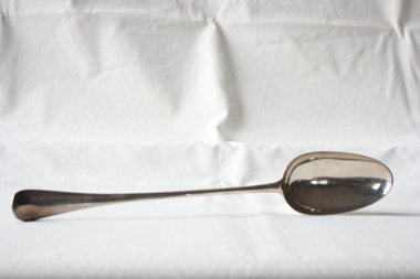 A sterling silver George II basting, stuffing, and hash spoon.
