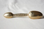 The reverse side of the medicine spoon.