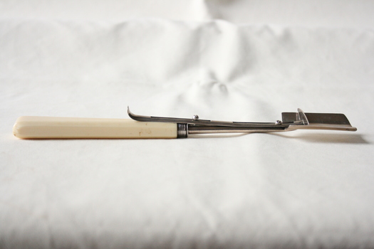 The cheese scoop in the "open" position.