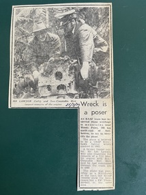 Newspaper (Item) - "Wreck is a Poser" - discovery of WW2  Kittyhawk crash site near woods point 180km NE Melbourne - Photo Mr Lawson & Sen-Constable Hirt inspect remains of engine, Newspaper article on discovery of kittyhawk wreck found at Woods Point (dated 25/7/79)