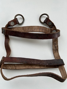 Accessory (Item) - Water Bottle Leather Riveted Harness, Without Carry Strap, Water bottle leather riveted harness, without carry strap.Has possible service number 11925 inscribed on inside of upper strap of harness .Believed to be Roy Douglas Mulcahy who served in the RAAF