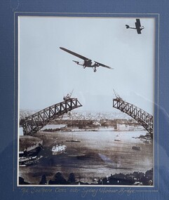 Print (item) - The Southern Cross passing over Sydney Harbour Bridge