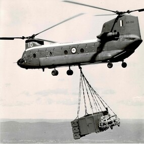 Photograph (Item) - Photos of RAAF Chinook A15-010 and Heuy 506 - both carrying loads (including Landrover)