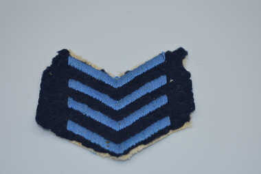 Uniform (item) - Service Chevron, Four Royal Blue Stripes On A Blue Cloth Background