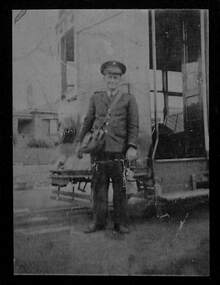 Geelong tramway conductor standing in front of a Birney car, about 1942.