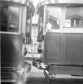 Close up photo of a single trucker and a bogie tram showing difference in bumper heights.